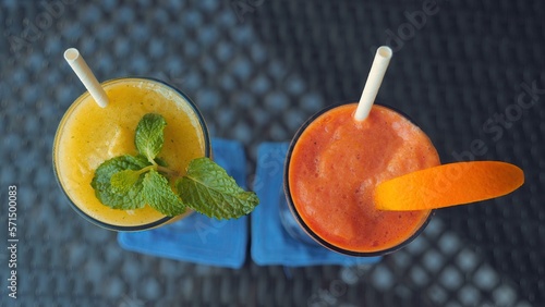 Top view of papaya and mango smoothie on restaurant table