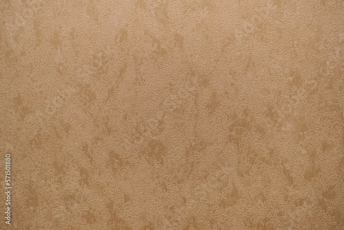 The wallpaper in tan and brown design