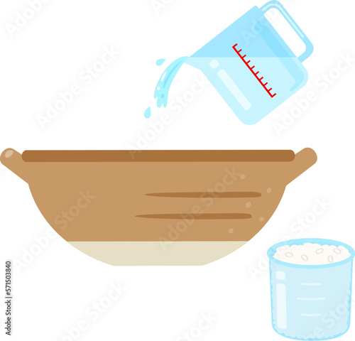 米と水の入った計量カップ、水加減