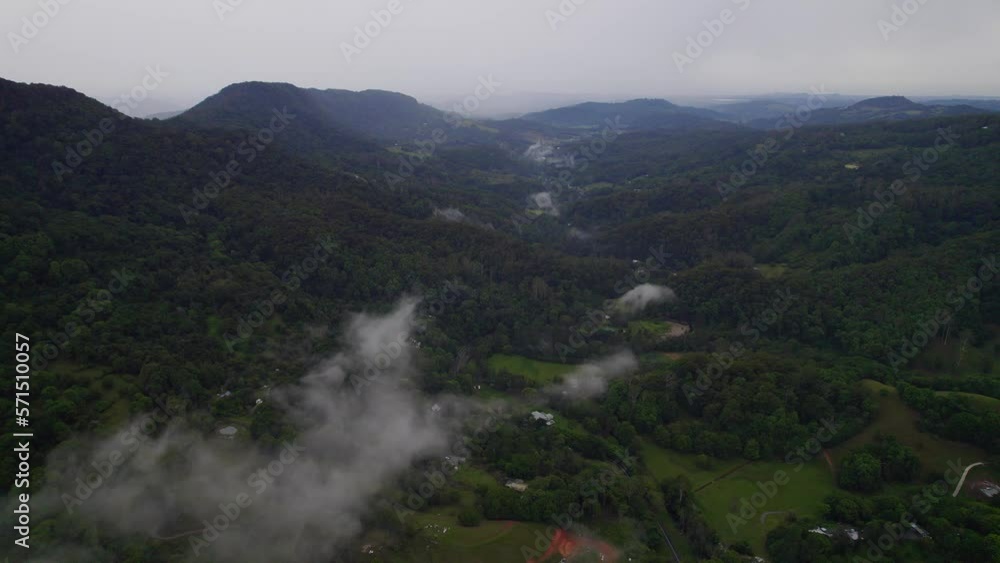Green Rainforest And Mountains Of Currumbin Valley In Gold Coast, QLD, Australia - aerial drone shot Green Rainforest And Mountains Of Currumbin Valley In Gold Coast, QLD, Australia - aerial drone shot