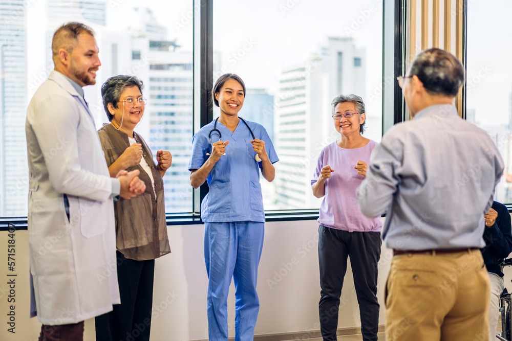 Fototapeta premium Portrait of asian woman physiotherapist trainer carer helping physical and discussing consulting talk with group asian senior patient by doing yoga workout exercises in rehabilitation at hospital