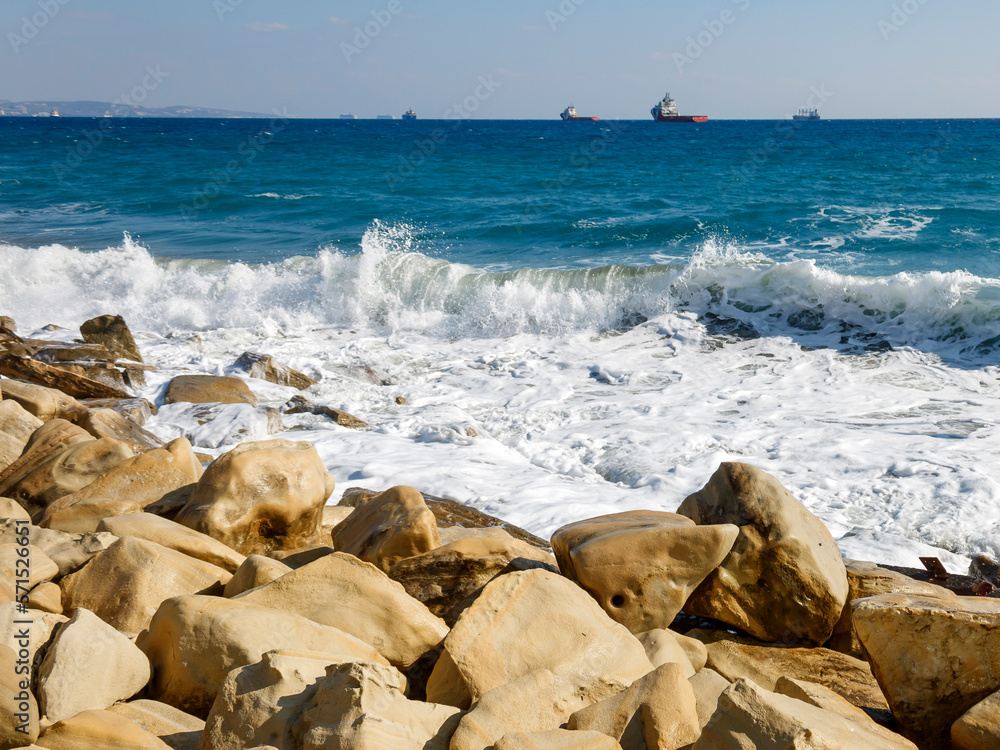 Yellow sea rocks and white foamy waves at Limassol coastline, Cyprus Yellow sea rocks and white foamy waves at Limassol coastline, Cyprus
