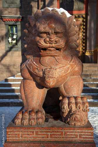 Sculpture of a guardian lion. Datsan  Gunzechoyney, Saint Petersburg photo