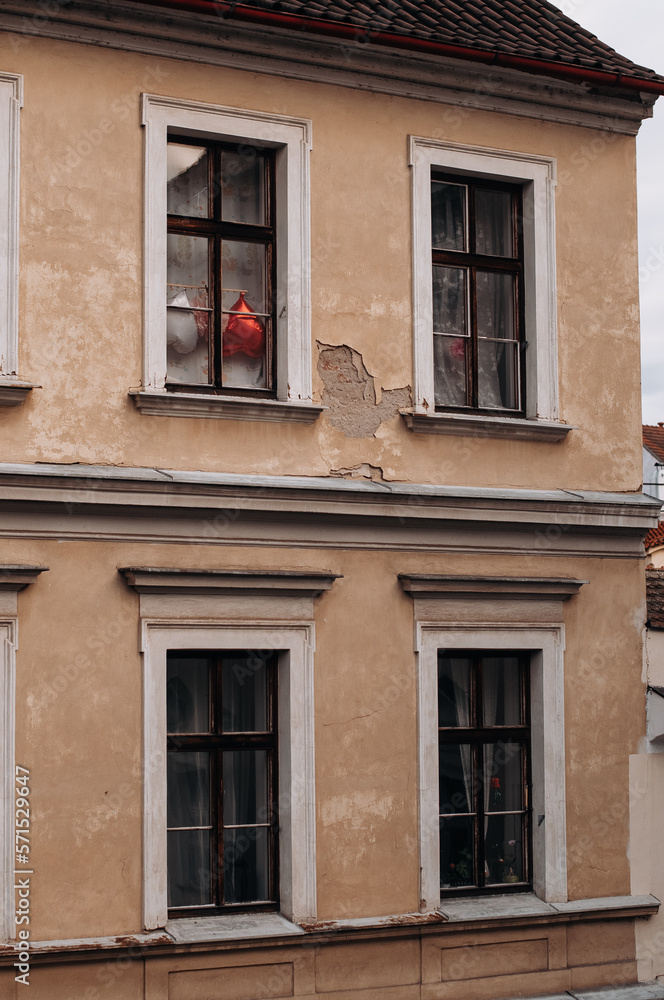 Heart-shaped balloons in the window of a house in Prague, Czech Republic.