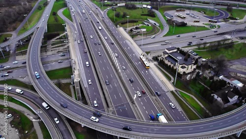 Aerial drone top view of multilevel highway with bridges and ramps, and cars going. High quality 4k footage