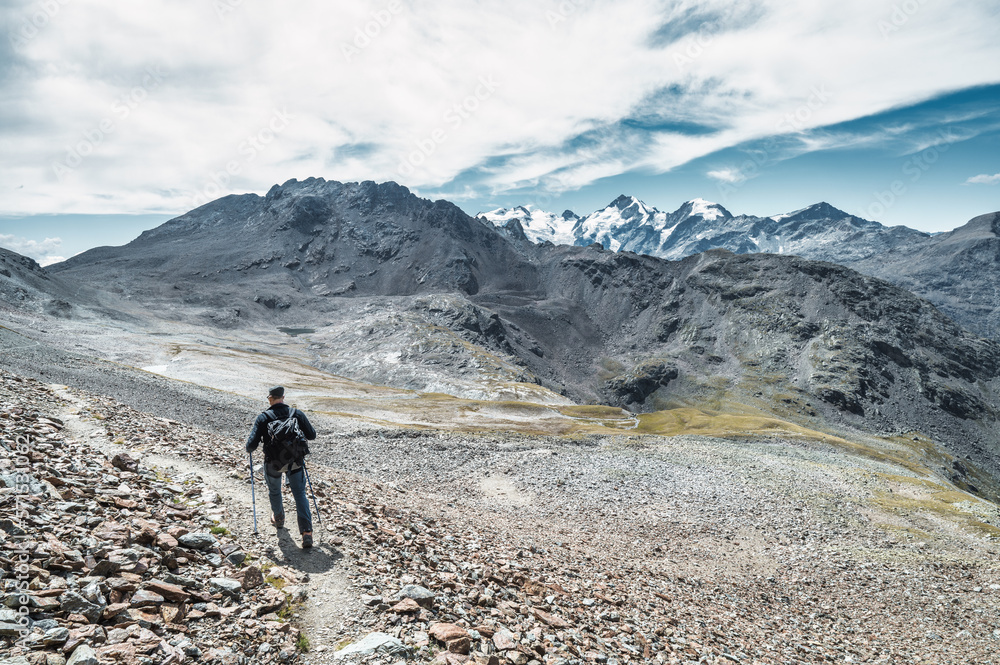 Man alone on high mountain trail