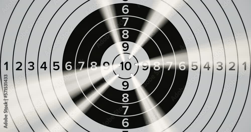 Target For Bullets Precise target shooting. Bullets hit a bullseye with light from holes ...