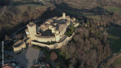 drone aeria sunsetl view of Vigoleno Castle , fortress village and hills, scenic panorama in Parma, Emilia Romagna , Italy. photo