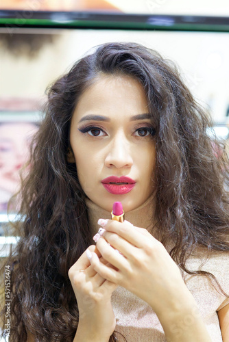 A girl in a cosmetics store. Fashion and beauty industry