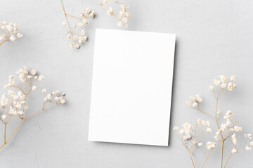 Wedding invitation card mockup with flowers, blank card flat lay with copy space