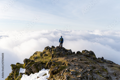 Canvas Print Person on top of a Mountain above the clouds