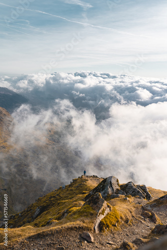 Canvas Print Person on top of a Mountain above the clouds