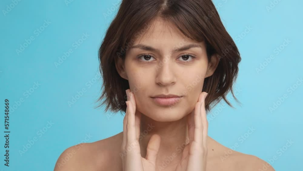 Portrait brunette hair woman takes care of her skin. Cosmetic concept Portrait brunette hair woman takes care of her skin. Cosmetic concept