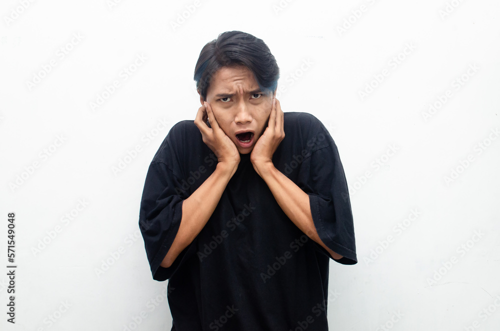 asian man with peek a boo hair screaming madly and angrily. asian man looks depressed and messed up. Irritated man bites lips and scratches head. stressed over work concept. asian man looks furious asian man with peek a boo hair screaming madly and angrily. asian man looks depressed and messed up. Irritated man bites lips and scratches head. stressed over work concept. asian man looks furious