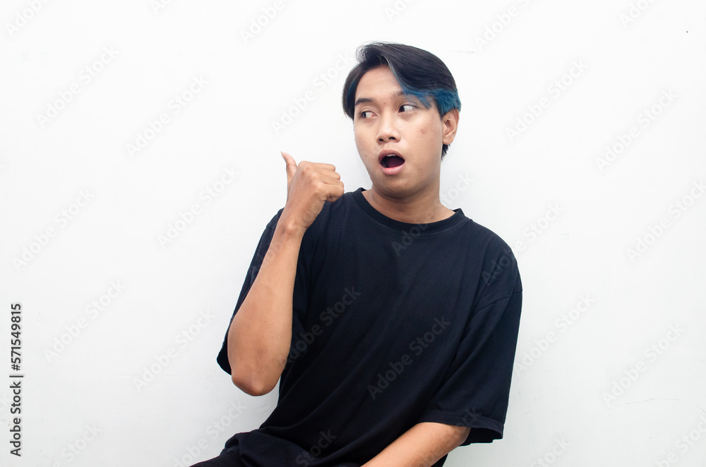 wow shocked expression of young asian man in peek a boo hair. wow shocked expression of young asian man in peek a boo hair.
