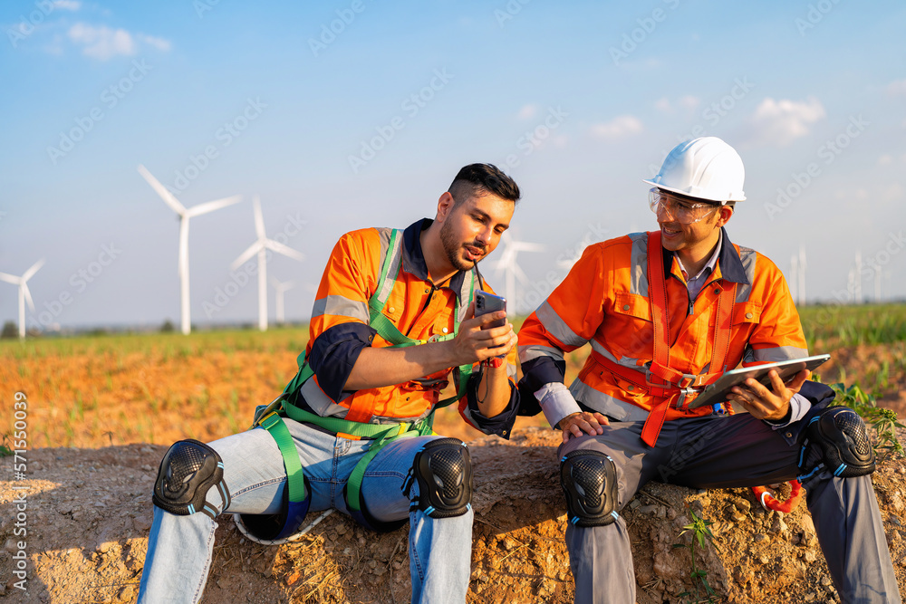 Wind turbine maintenance engineer on break time relax before repair renewable electricity generator