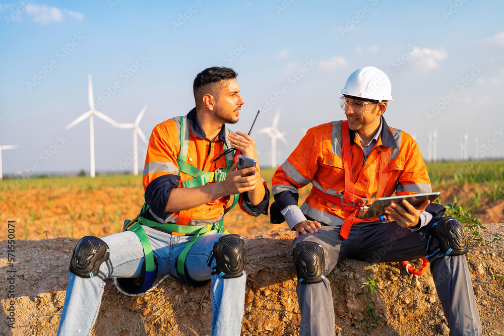 Wind turbine maintenance engineer on break time relax before repair renewable electricity generator