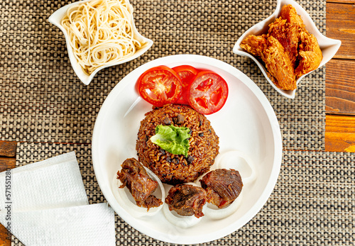 jollof with red chili paste and chicken and meat