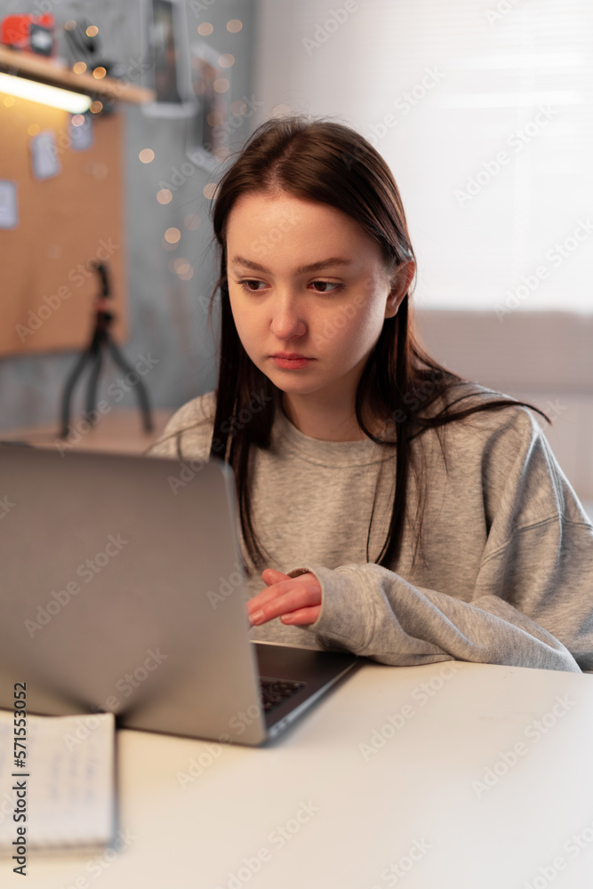 Study from home. Frustrated asian woman girl looking at laptop while studying online class, e-learning.