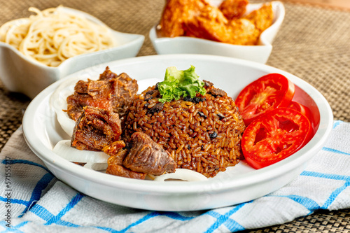 jollof with red chili paste and chicken and meat
