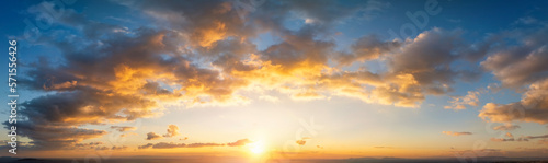 A wide panorama of a beautiful sunset sky as background or texture