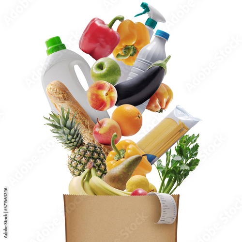 Картината върху платно Assorted groceries falling in a paper bag