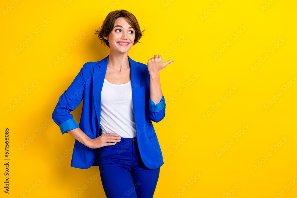 Photo of professional hr manager recruiter wear blue jacket looking opening new it company demonstrate brand isolated on yellow color background Photo of professional hr manager recruiter wear blue jacket looking opening new it company demonstrate brand isolated on yellow color background