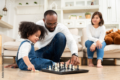 African family, father, mother, daughter doing various activities together on holiday or family day in house or neighborhood, happily.