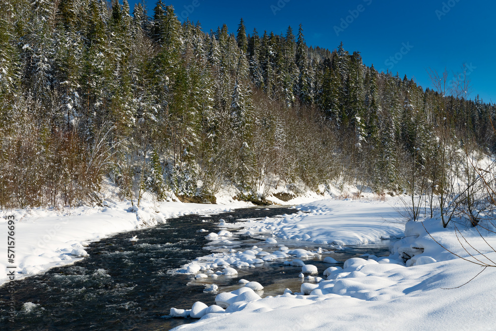 Winter panorama of Podhale. In the foreground Bialka River. Bialka Tatrzanska, Poland. Winter panorama of Podhale. In the foreground Bialka River. Bialka Tatrzanska, Poland.