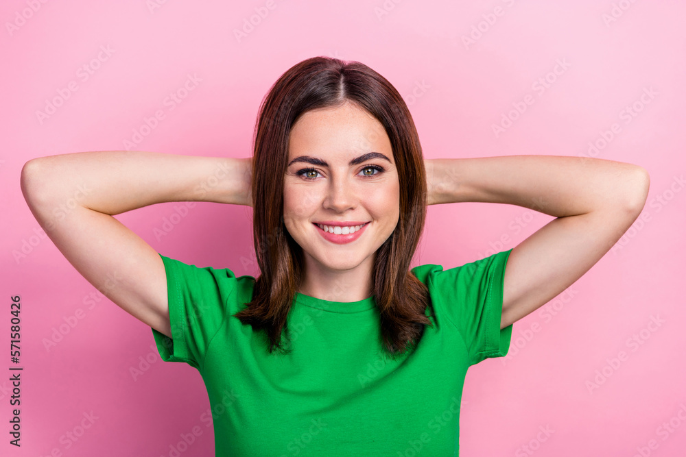 Photo of adorable satisfied person beaming smile arms behind head isolated on pink color background Photo of adorable satisfied person beaming smile arms behind head isolated on pink color background