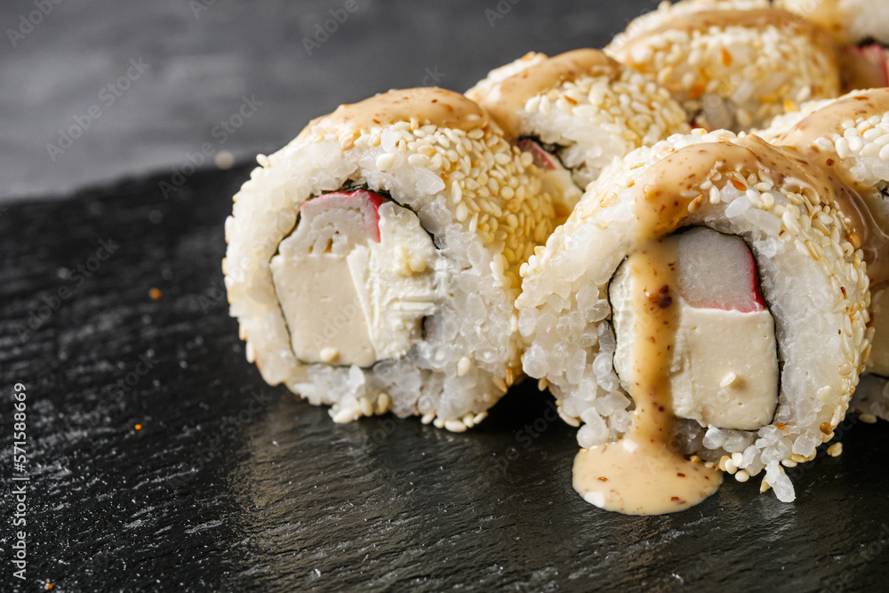 sushi roll with sesame crab stick tofu and Philadelphia cheese sushi roll with sesame crab stick tofu and Philadelphia cheese