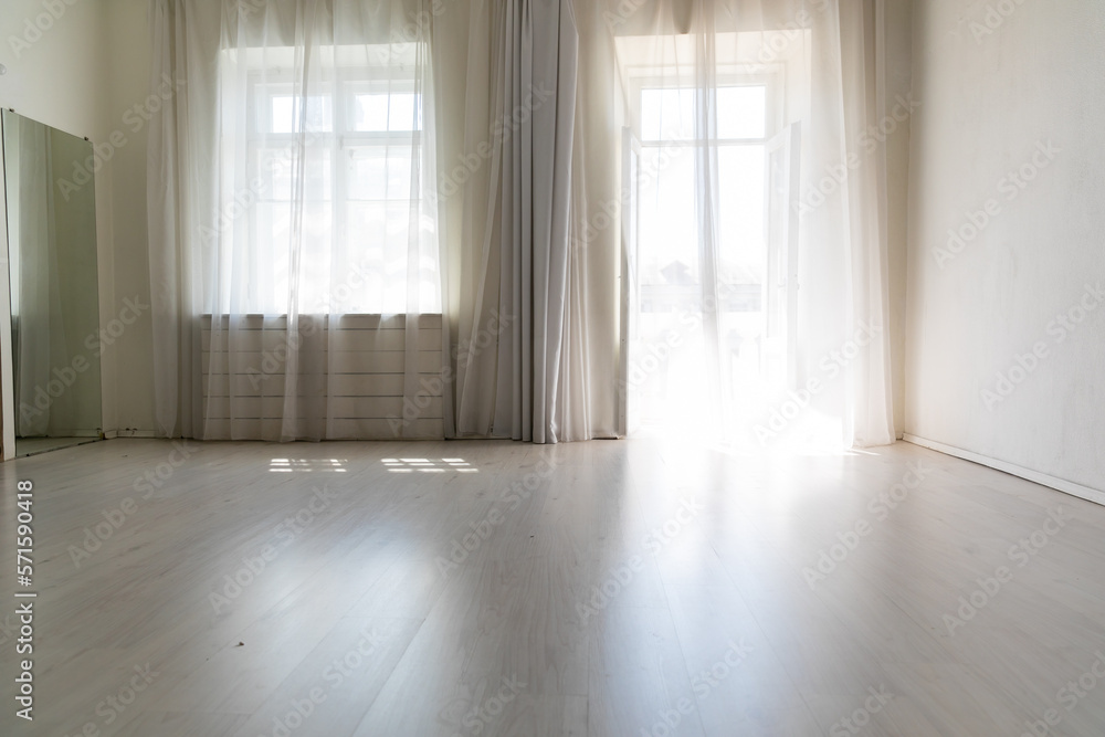 Fototapeta premium large bright room with window and curtains in the apartment
