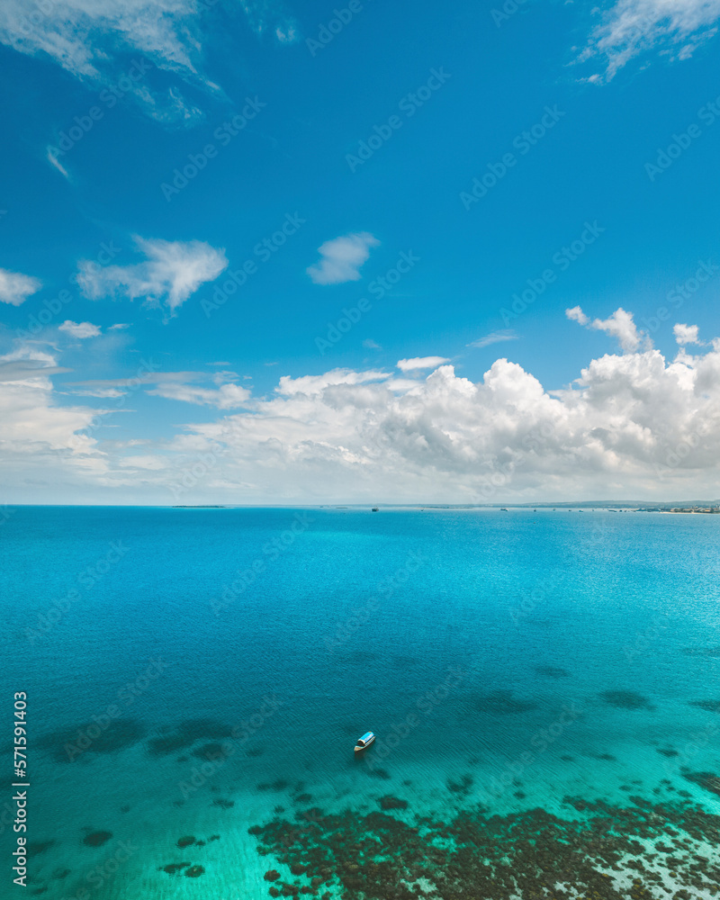 Aerial view of a small boat at Sand Bank, Zanzibar, Tanzania. Aerial view of a small boat at Sand Bank, Zanzibar, Tanzania.
