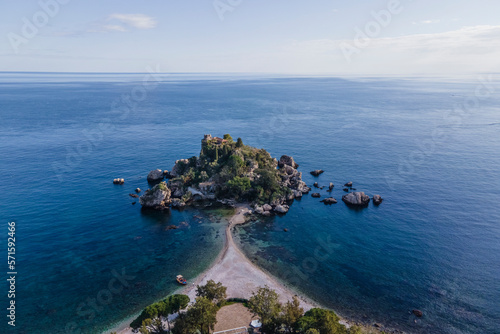 Aerial view of Isola Bella, a small island and touristic spot along the coastline in Taormina, Messina, Sicily, Italy. photo