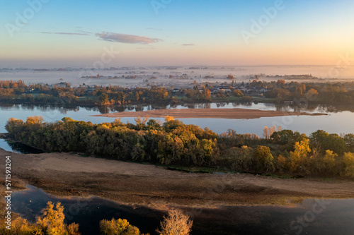 Aerial view of Loire river with sandbanks at sunset in Gennes, Maine-et-Loire, France.