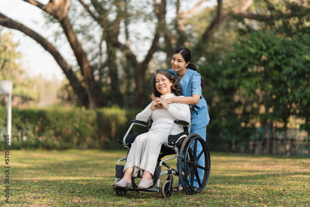 Elderly asian senior woman on wheelchair with nurse. Nursing home hospital garden concept. Elderly asian senior woman on wheelchair with nurse. Nursing home hospital garden concept.