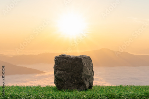 Stone podium table top with outdoor mountains golden pastel color scene nature landscape at sunrise blur background.Natural beauty cosmetic or healthy product placement presentation pedestal display.
