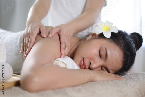 Masseur doing massage on woman body in the spa salon. Body care and beauty treatment concept.