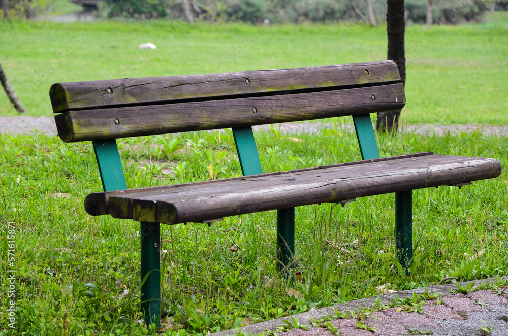 Wooden bench seat in park.
