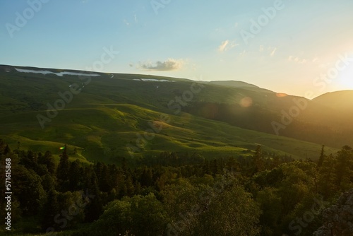 Fototapeta Naklejka Na Ścianę i Meble -  Sunset in the mountains. Beauty in the wild. Landscape with trees.