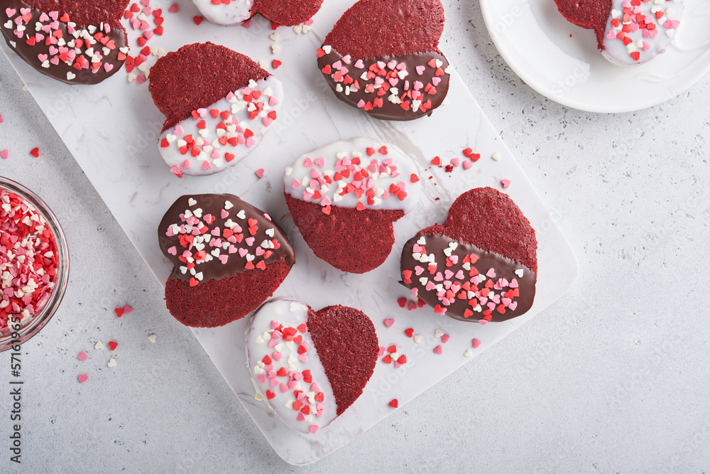 Fototapeta premium Valentines Day. Red velvet or brownie cookies on heart shaped in chocolate icing on a pink romantic background. Dessert idea for Valentines Day, Mothers or Womens Day. Tasty homemade dessert cake