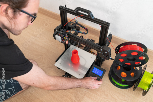 Modern 3D printer and multi-colored filament spools