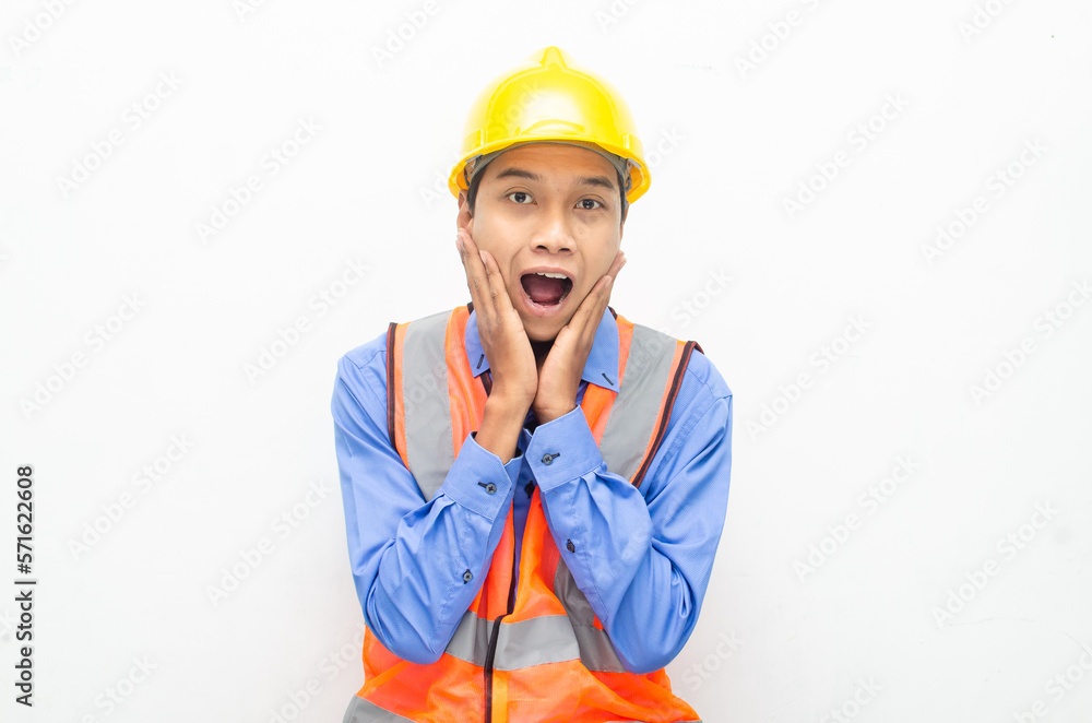 overjoyed asian male construction worker opening mouth shocked and surprised. construction worker with wow expression. overjoyed asian male construction worker opening mouth shocked and surprised. construction worker with wow expression.