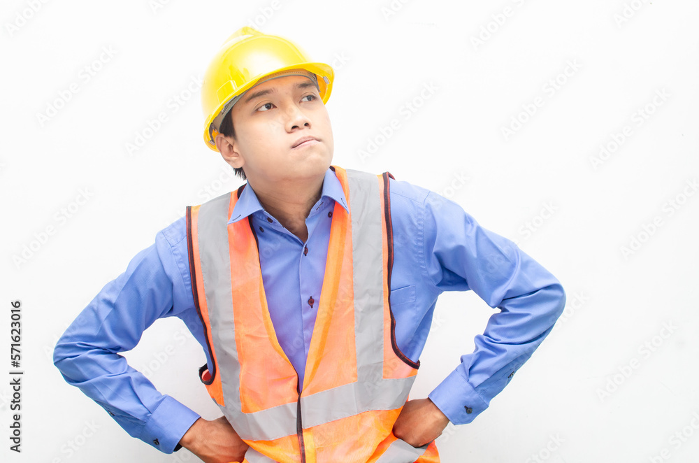 thoughtful asian male construction worker in pensive mood doing thinking and wondering gesture. thoughtful asian male construction worker in pensive mood doing thinking and wondering gesture.