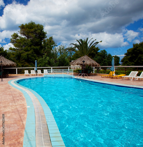Swimming pool. Summer day. Greece. Travel concept. © Raisa Kanareva
