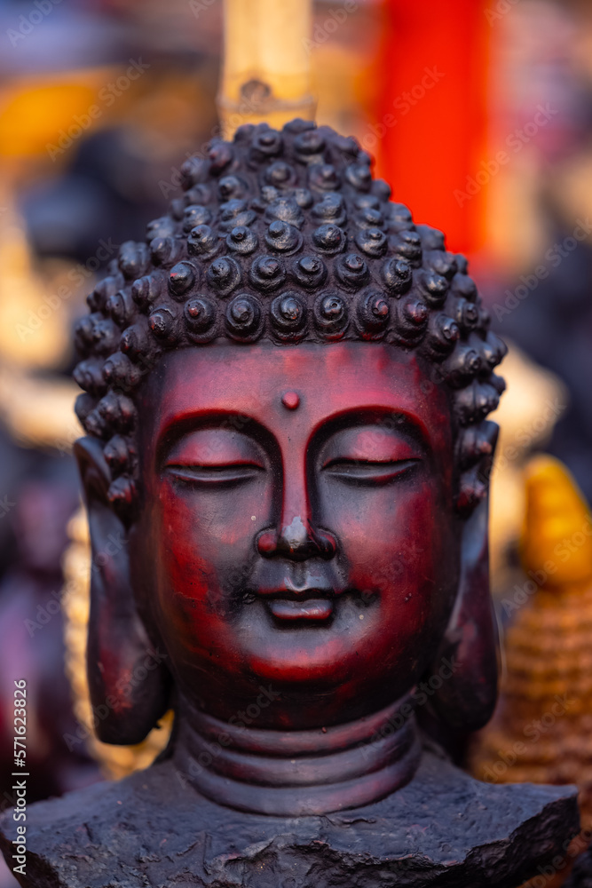 Wooden art, Lord Buddha idol made with wooden as buddhism art. Selective focus on face.