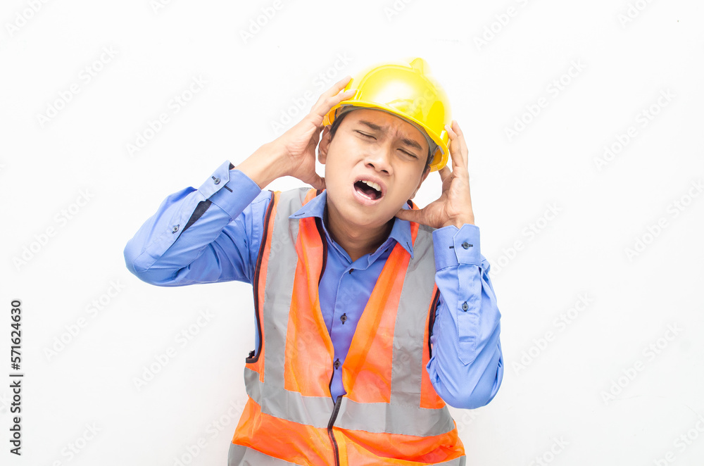 stressed over work concept illustrated by asian male construction worker in blue shirt, orange vest and yellow safety helmet with furious, mad, sad, angry expression. overworked concept stressed over work concept illustrated by asian male construction worker in blue shirt, orange vest and yellow safety helmet with furious, mad, sad, angry expression. overworked concept