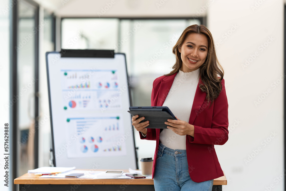 Asian Business woman working at home office and analyze financial report document. Accounting and Finance concept Asian Business woman working at home office and analyze financial report document. Accounting and Finance concept