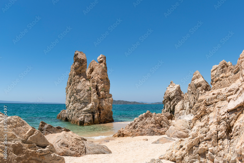 Paradise hidden sandy sea beach and unique bizarre rock formations on Trimi beach of Athos peninsula of Halkidiki near Ouranoupoli, northern Greece. Natural wonder nature, travel destination Paradise hidden sandy sea beach and unique bizarre rock formations on Trimi beach of Athos peninsula of Halkidiki near Ouranoupoli, northern Greece. Natural wonder nature, travel destination