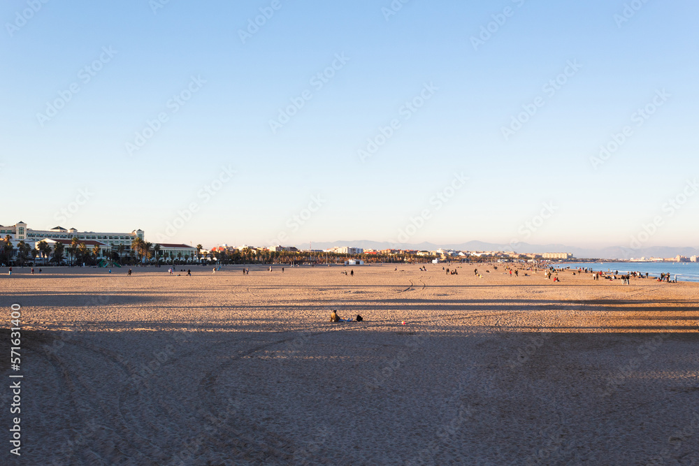 View of Malvarrosa beach on a sunny and calm winter afternoon. Valencia - Spain View of Malvarrosa beach on a sunny and calm winter afternoon. Valencia - Spain